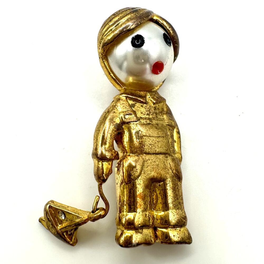 Vintage gold tone boy child with sailboat faux pearl articulated figural brooch